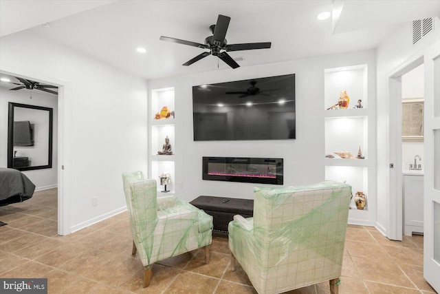 living room with a glass covered fireplace, recessed lighting, a ceiling fan, light tile patterned flooring, and visible vents