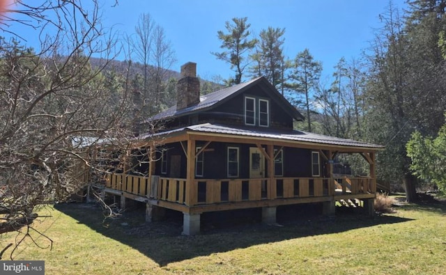 1636 Narrows Rd, Howard, PA 16841 - back of house with a chimney, metal roof, and a lawn