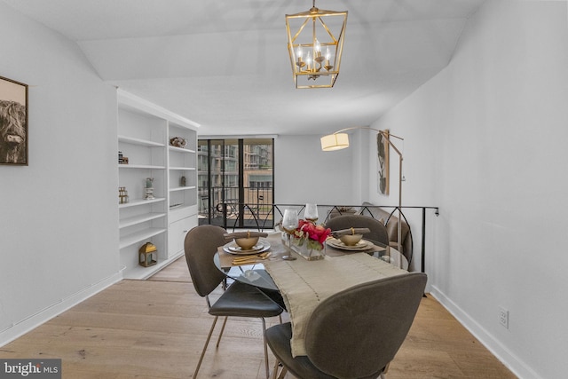 2201 L St NW Unit 515, Washington, DC 20037 - dining area with a chandelier and wood finished floors