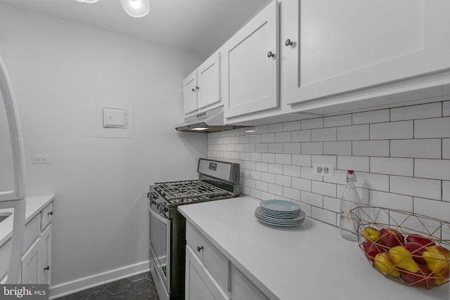 2201 L St NW Unit 515, Washington, DC 20037 - kitchen featuring stainless steel gas range, under cabinet range hood, decorative backsplash, and light countertops