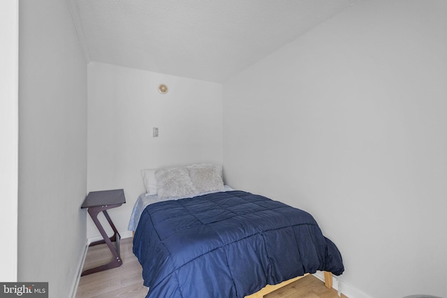 2201 L St NW Unit 515, Washington, DC 20037 - bedroom with wood finished floors and baseboards