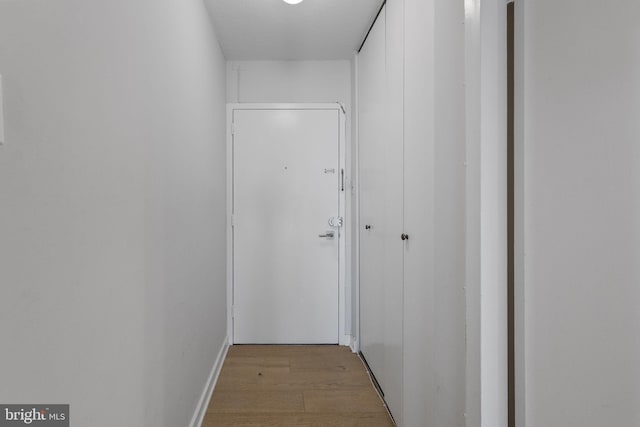 2201 L St NW Unit 515, Washington, DC 20037 - corridor featuring light wood-style flooring and baseboards