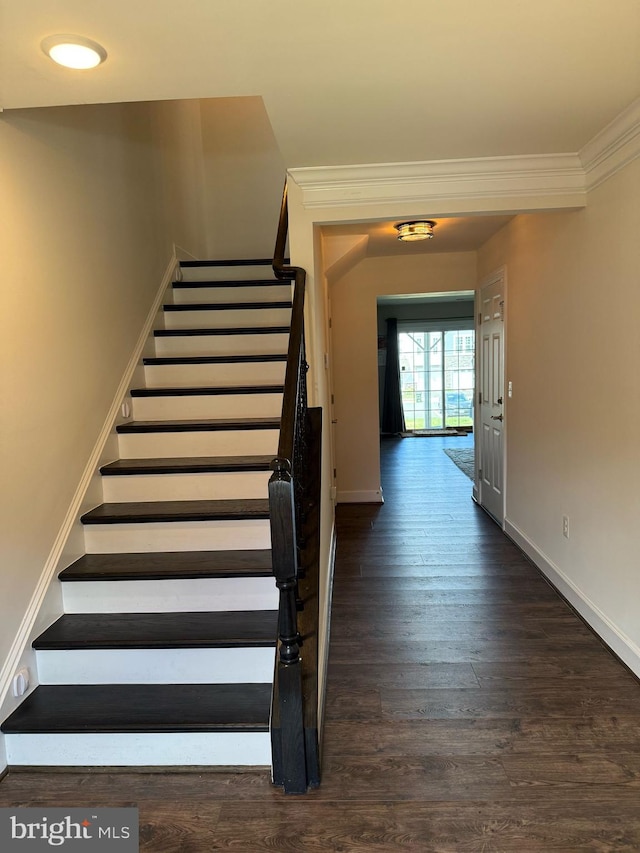 8676 Underhill Ln, Manassas, VA 20112 - stairs featuring crown molding, wood finished floors, and baseboards