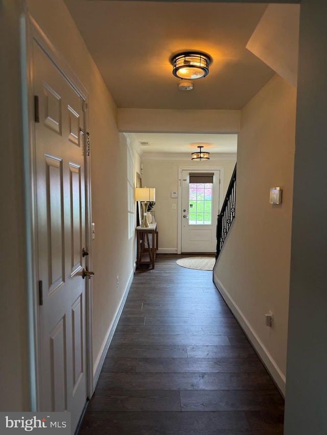 8676 Underhill Ln, Manassas, VA 20112 - entryway featuring stairs, dark wood-type flooring, and baseboards
