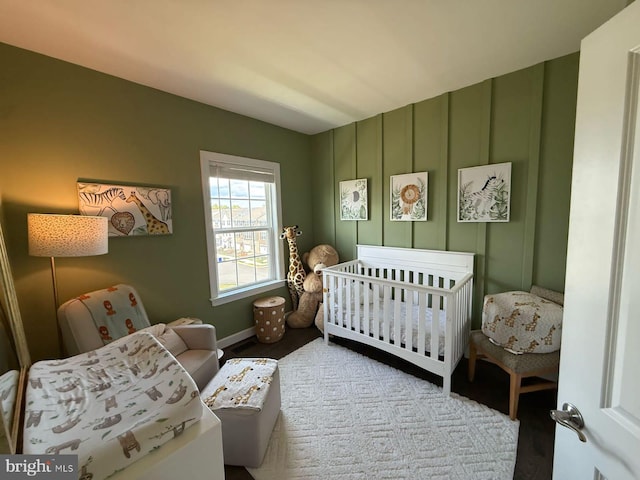 8676 Underhill Ln, Manassas, VA 20112 - bedroom with baseboards and a crib