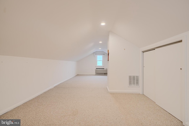 additional living space featuring baseboards, vaulted ceiling, recessed lighting, carpet flooring, and visible vents