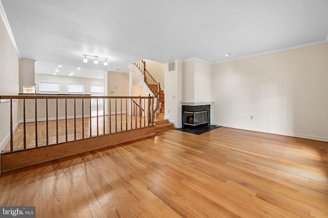 922 Fell St, Baltimore, MD 21231 - unfurnished living room featuring crown molding, wood finished floors, baseboards, and visible vents