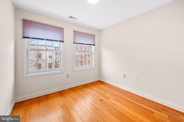 922 Fell St, Baltimore, MD 21231 - empty room with light wood finished floors, visible vents, and baseboards