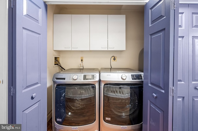 922 Fell St, Baltimore, MD 21231 - laundry room featuring cabinet space and independent washer and dryer