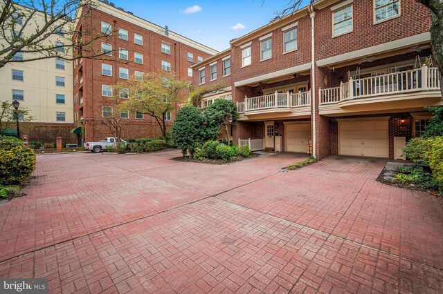 922 Fell St, Baltimore, MD 21231 - exterior space featuring a garage and driveway