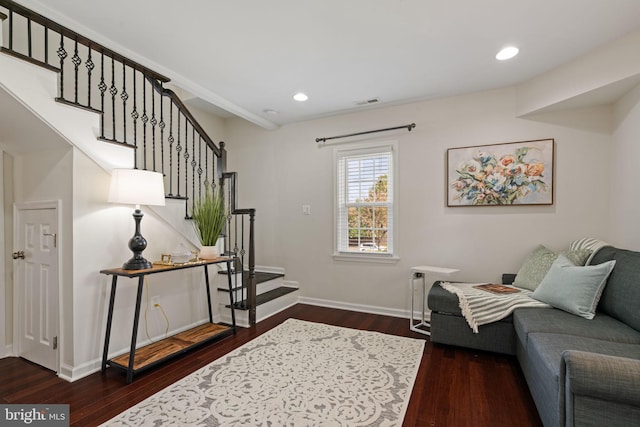 living room with recessed lighting, stairway, baseboards, and wood finished floors