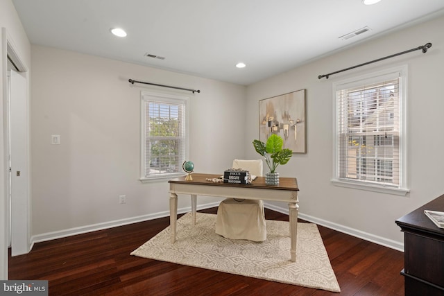 office featuring baseboards, wood finished floors, and visible vents