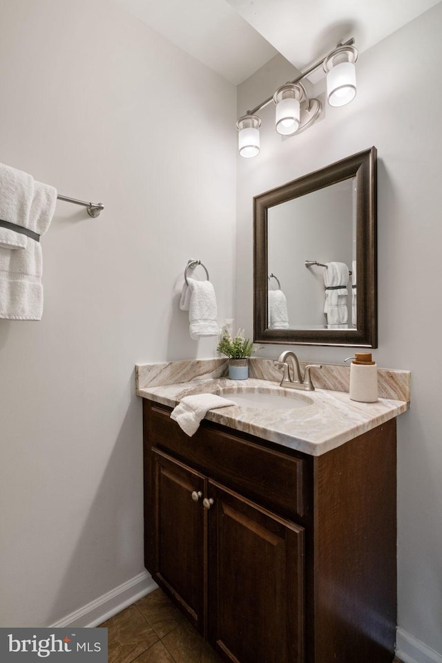 bathroom featuring baseboards, vanity, and tile patterned floors