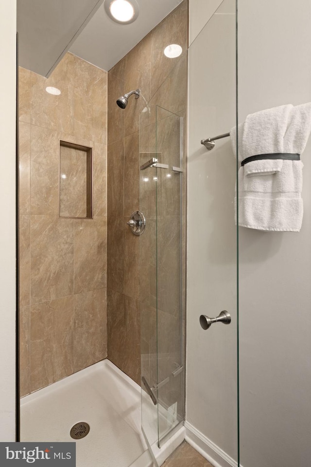 full bathroom featuring a shower stall