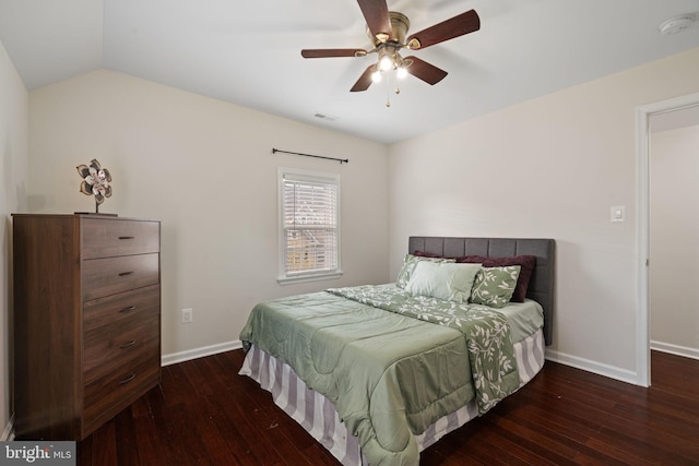 bedroom with hardwood / wood-style flooring, baseboards, lofted ceiling, and visible vents