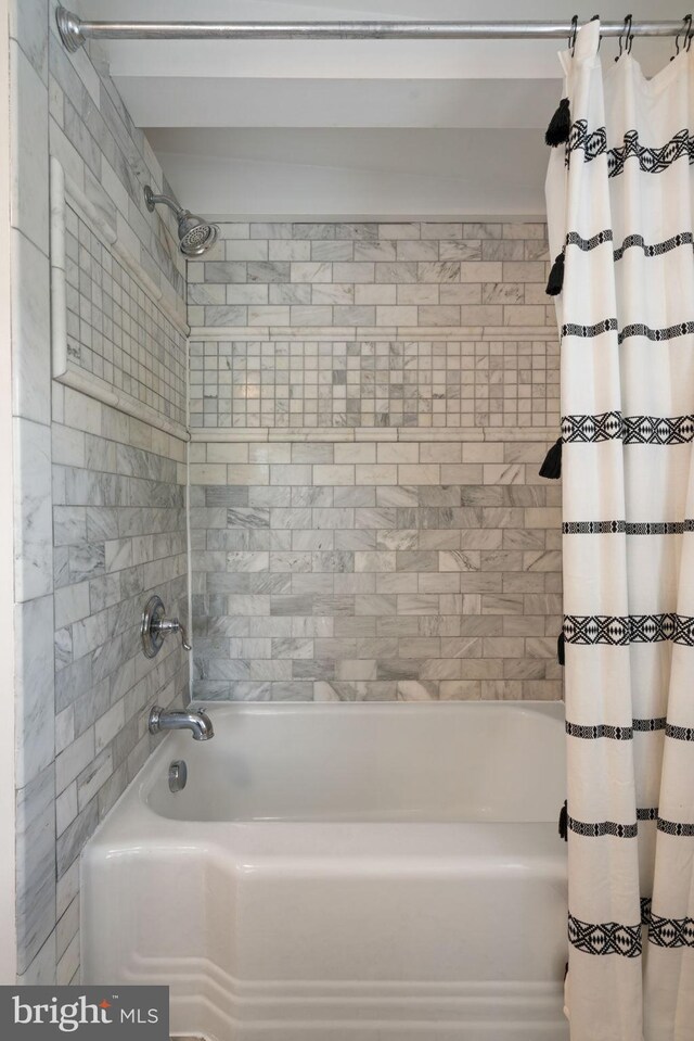 full bath with shower / bath combination with curtain