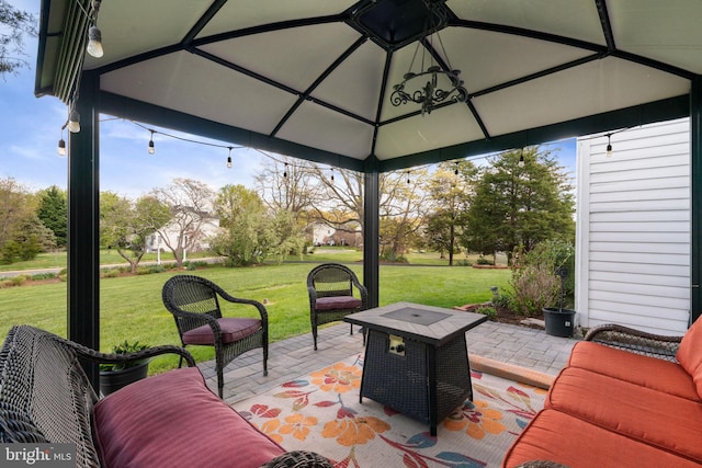 view of patio / terrace with an outdoor fire pit