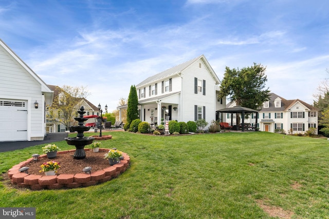 view of property exterior with a lawn and a gazebo