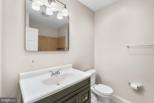 2415 Saint Paul St, Baltimore, MD 21218 - bathroom featuring toilet, vanity, and baseboards