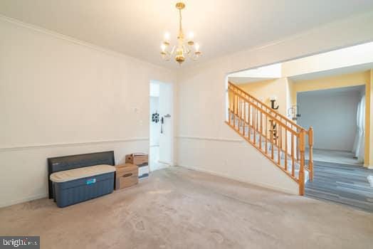 17661 Avenel Ln, Dumfries, VA 22026 - interior space featuring a chandelier, carpet, and stairs
