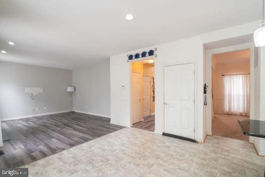 17661 Avenel Ln, Dumfries, VA 22026 - spare room with wood finished floors, recessed lighting, and baseboards