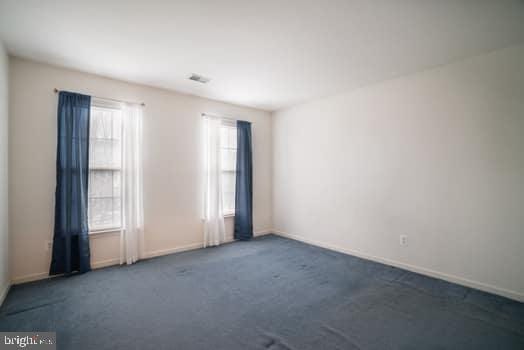 17661 Avenel Ln, Dumfries, VA 22026 - carpeted spare room with plenty of natural light and baseboards