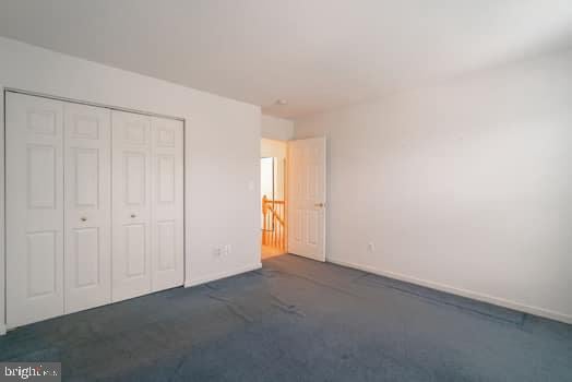 17661 Avenel Ln, Dumfries, VA 22026 - unfurnished bedroom featuring a closet and carpet flooring