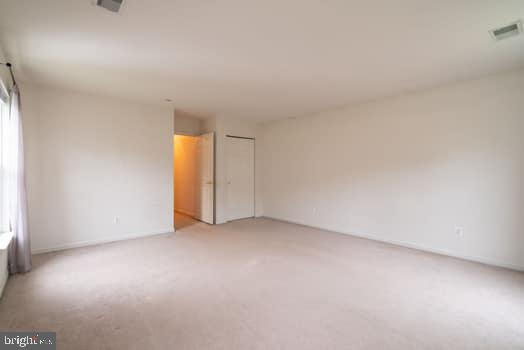 17661 Avenel Ln, Dumfries, VA 22026 - spare room featuring light carpet