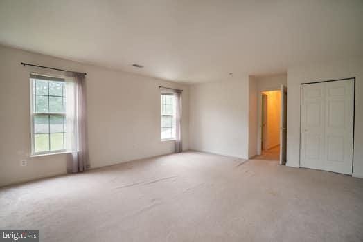 17661 Avenel Ln, Dumfries, VA 22026 - unfurnished bedroom featuring light carpet