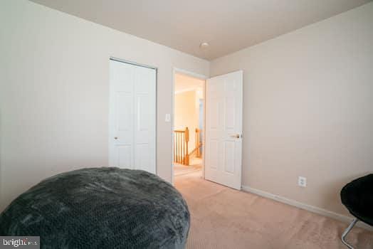 17661 Avenel Ln, Dumfries, VA 22026 - living area with light carpet and baseboards