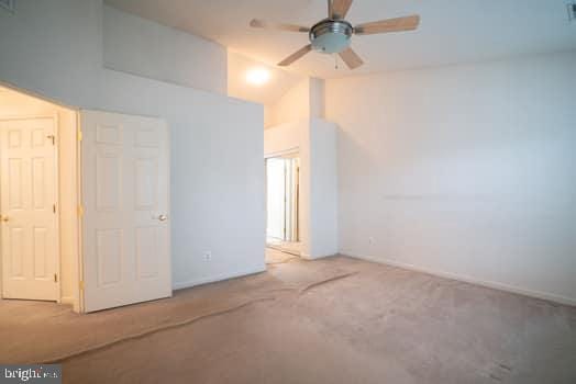 17661 Avenel Ln, Dumfries, VA 22026 - unfurnished bedroom with carpet flooring, vaulted ceiling, and baseboards