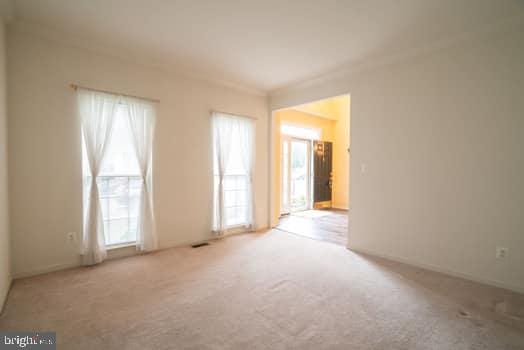 17661 Avenel Ln, Dumfries, VA 22026 - spare room with carpet flooring and healthy amount of natural light