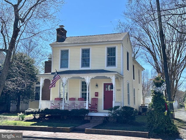 504 S Talbot St, Saint Michaels, MD 21663 - view of front of home with a porch and a chimney