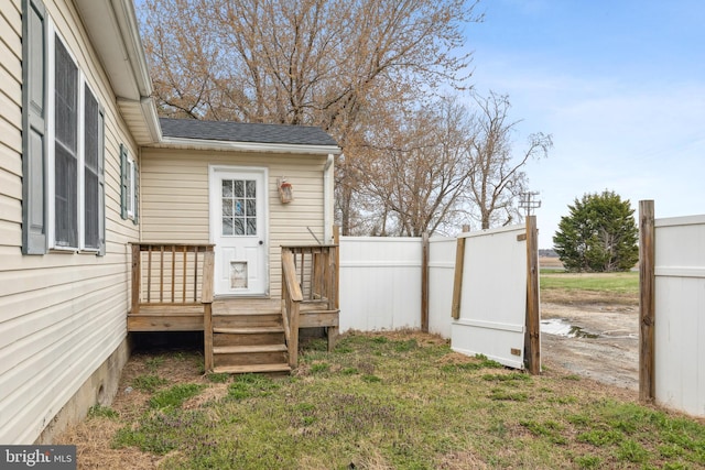 view of yard featuring fence and a wooden deck