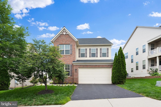 42694 Chisholm, Broadlands, VA 20148 - view of front facade with brick siding, driveway, a garage, a front yard, and a shingled roof