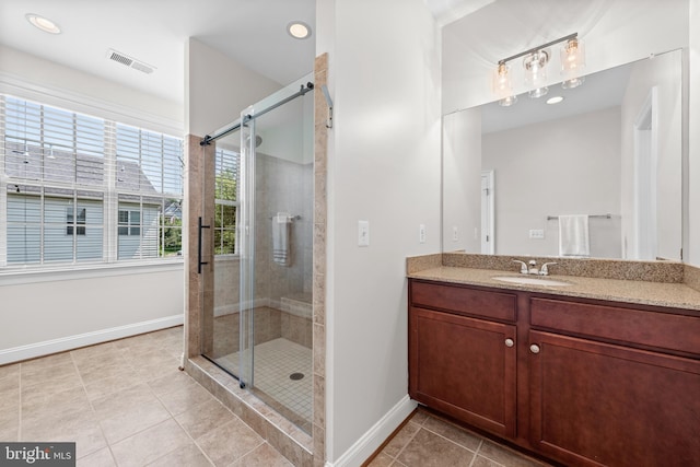 42694 Chisholm, Broadlands, VA 20148 - bathroom with tile patterned floors, vanity, baseboards, a stall shower, and recessed lighting