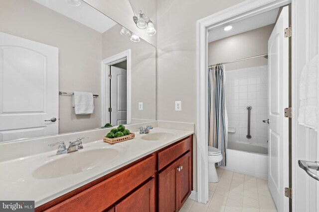 42694 Chisholm, Broadlands, VA 20148 - full bathroom with toilet, double vanity, tile patterned floors, and shower / bathtub combination with curtain