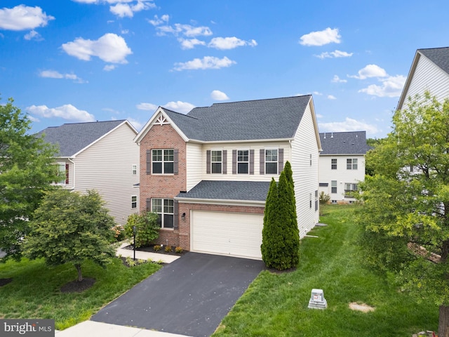 42694 Chisholm, Broadlands, VA 20148 - traditional-style house with brick siding, asphalt driveway, an attached garage, a front lawn, and roof with shingles