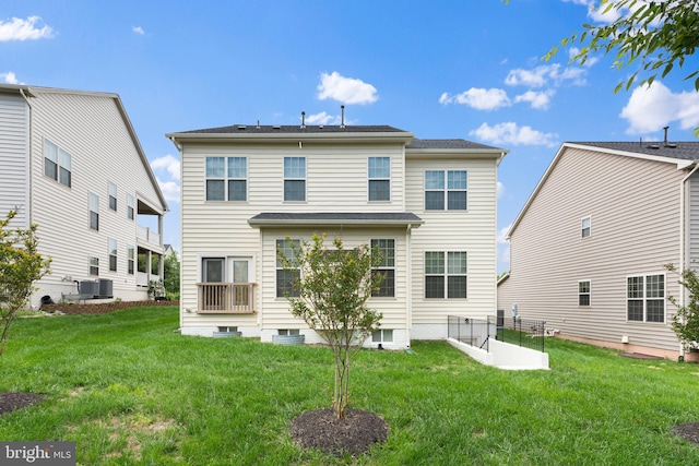42694 Chisholm, Broadlands, VA 20148 - rear view of house featuring a lawn and central air condition unit