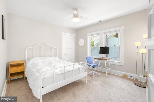 bedroom with carpet, visible vents, baseboards, and a ceiling fan