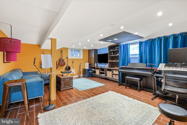 living area featuring wood finished floors and recessed lighting