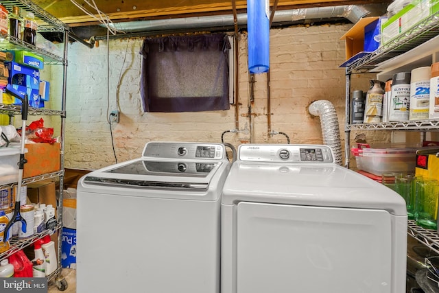 washroom with laundry area and washing machine and clothes dryer