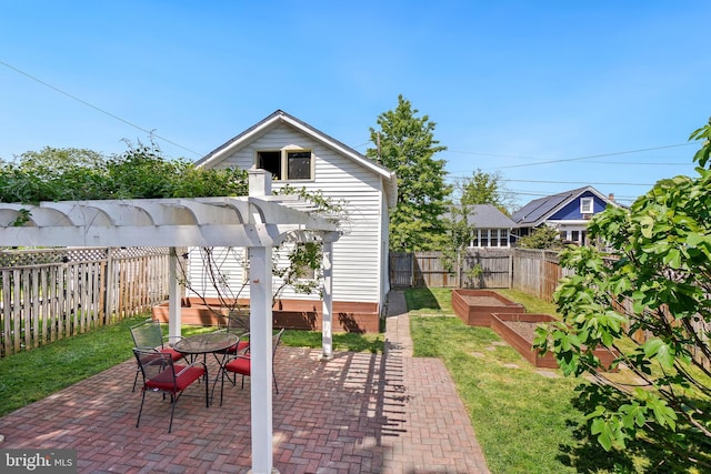 view of patio / terrace featuring a vegetable garden and a fenced backyard