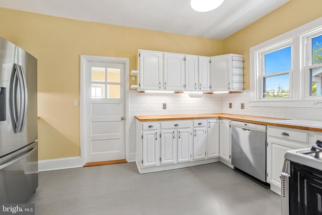 kitchen featuring decorative backsplash, plenty of natural light, and appliances with stainless steel finishes