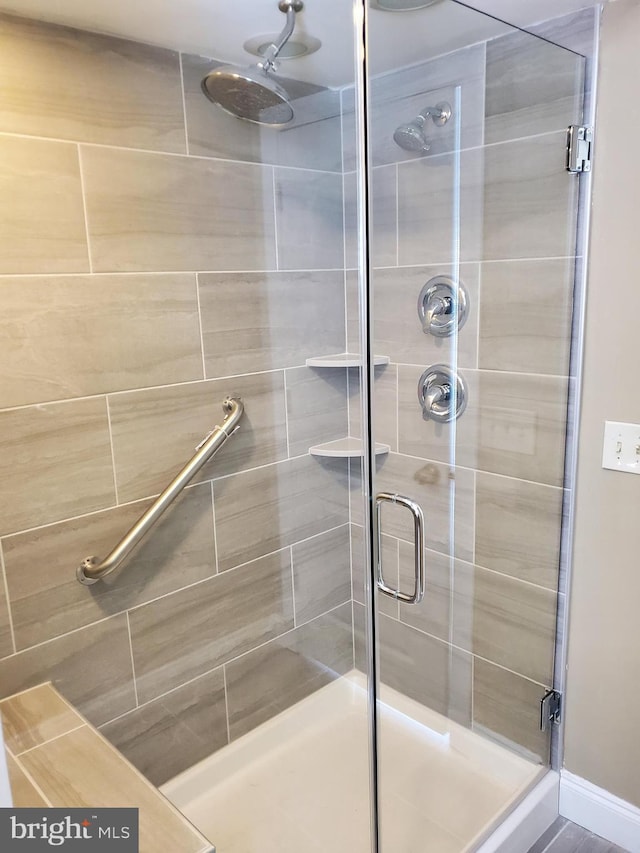 full bathroom featuring a stall shower