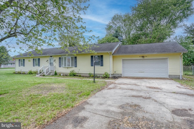 single story home with concrete driveway, a garage, a front yard, and a shingled roof