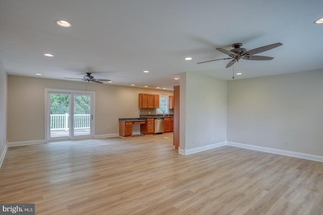 unfurnished living room with a ceiling fan, light wood-style flooring, recessed lighting, and baseboards