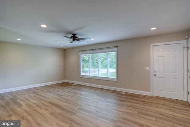 unfurnished room featuring recessed lighting, light wood-style flooring, baseboards, and ceiling fan