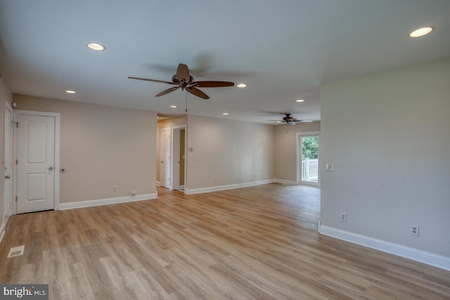 spare room with ceiling fan, recessed lighting, light wood-style flooring, and baseboards