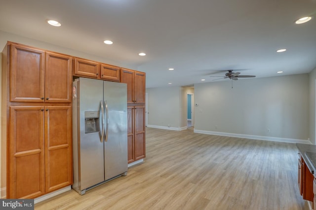 kitchen featuring stainless steel fridge, a ceiling fan, light wood finished floors, recessed lighting, and baseboards